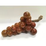 A vintage alabaster ornament of a bunch of grapes, approx width 44cm.