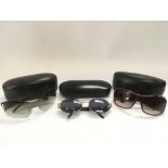 Three cased pairs of designer sunglasses comprisin