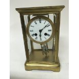 An Early 20th century brass cased four glass clock