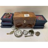 A small regency walnut veneered tea caddy together