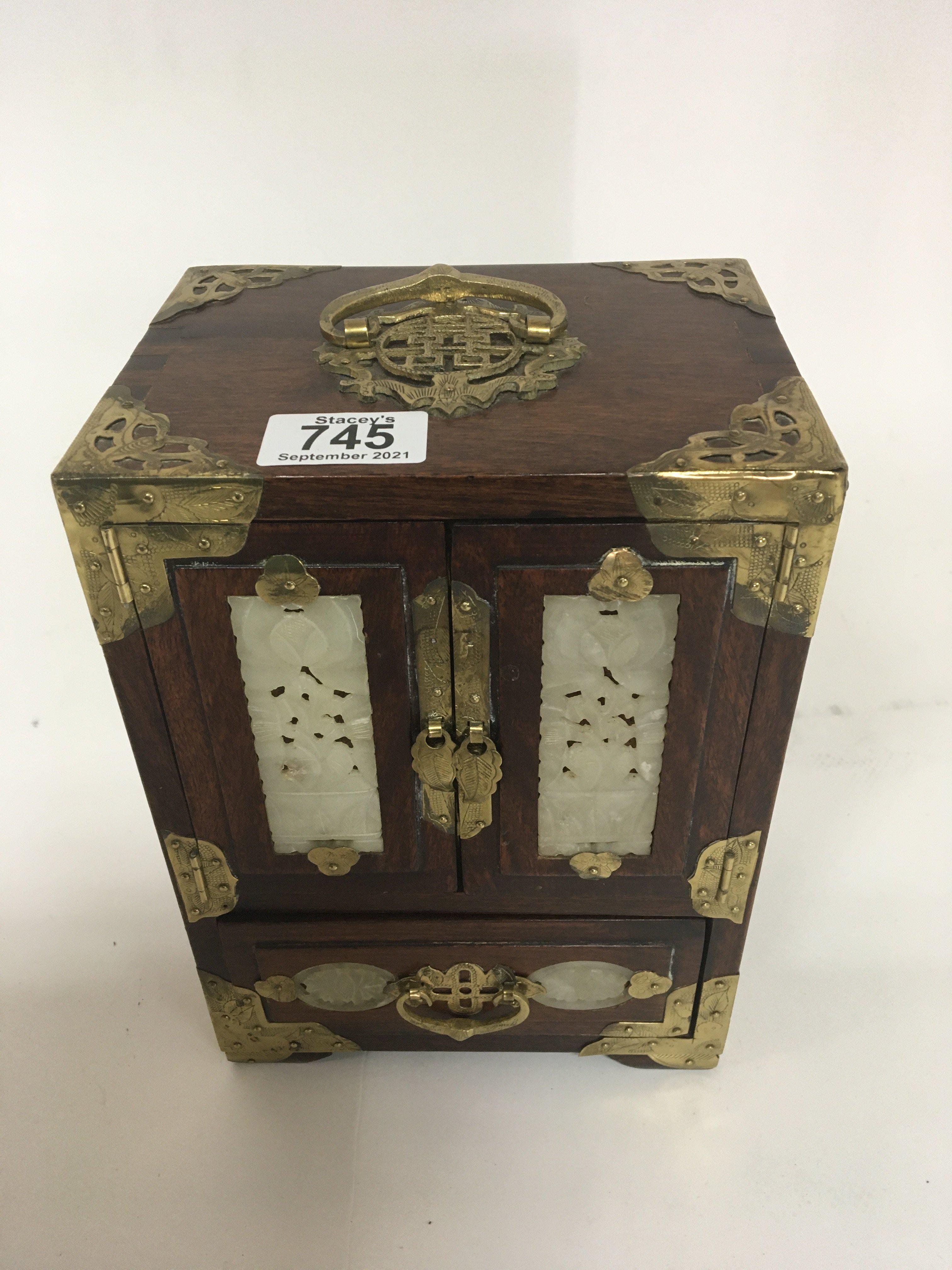 A Chinese hardwood jewellery box with carved jade