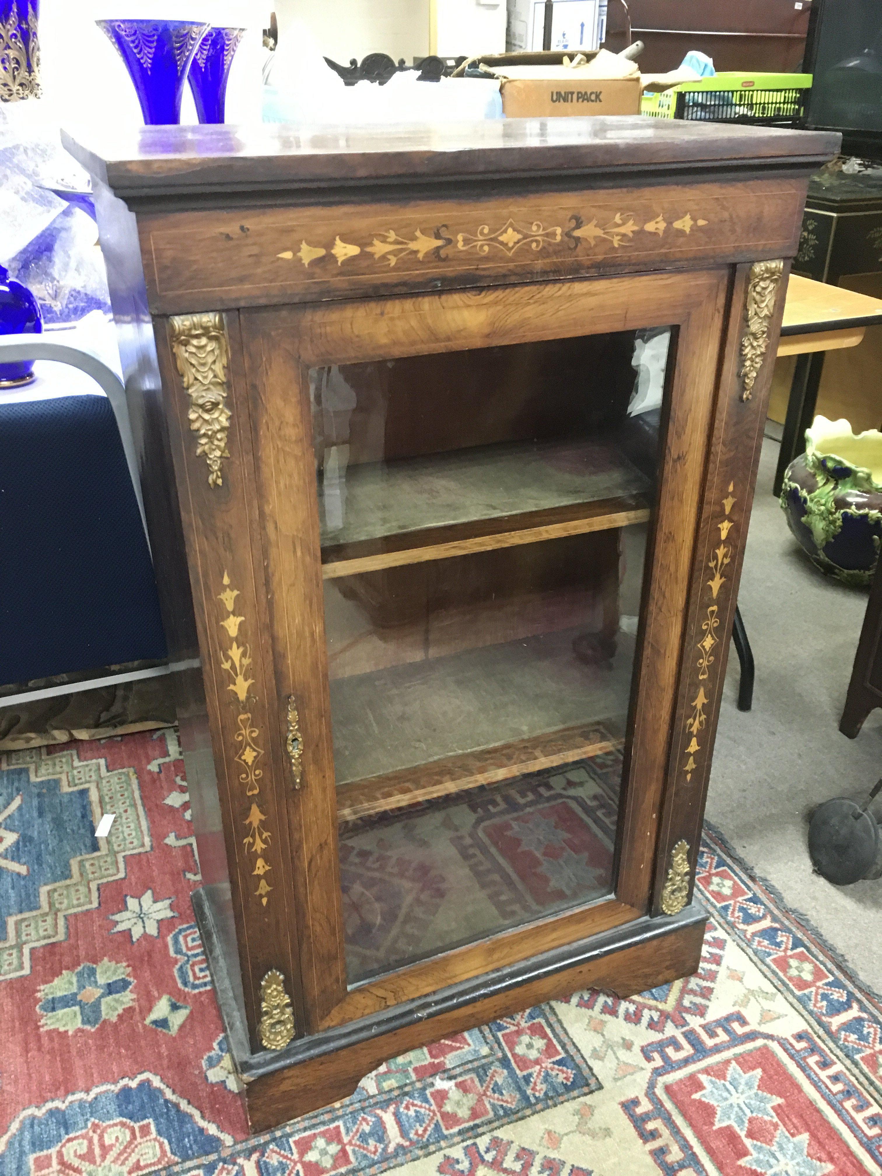 A Victorian inlaid rosewood pier cabinet with bras