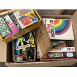 A box of mixed toys and games.