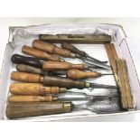 A collection of vintage tools comprising chisels a