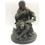 A late Victorian spelter figure of a scholar, appr