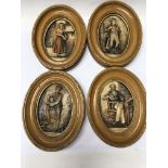 A collection of seven Charles Dickens plaques .