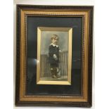 A framed picture of a young boy - NO RESERVE