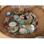 A basket of vintage brooches and costume jewellery