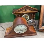 A man hog any mantle clock together with a 4 pilla