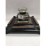 A large glass inkwell with stand .