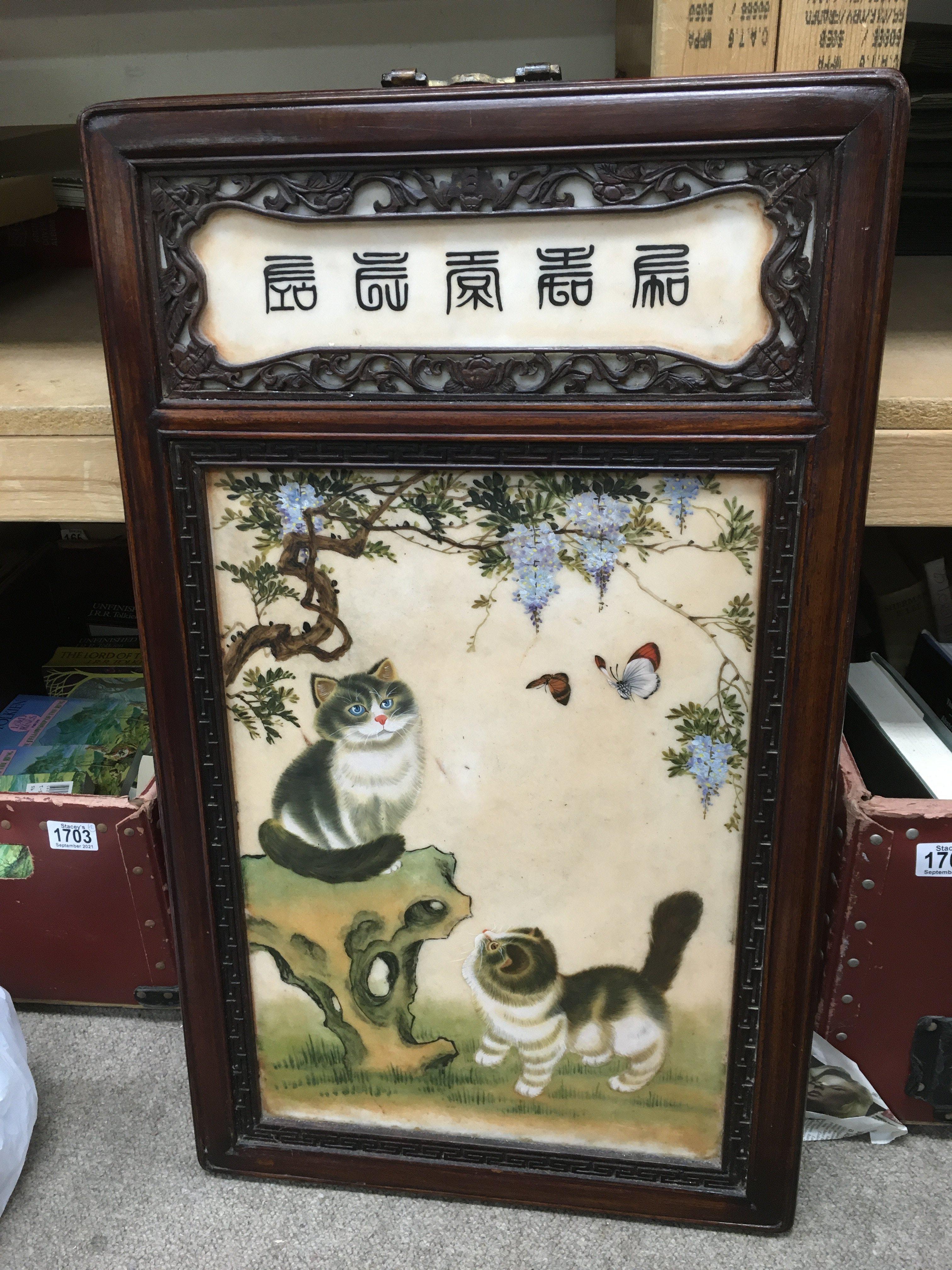 An Oriental ceramic screen decorated with kittens