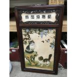 An Oriental ceramic screen decorated with kittens