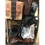 A box containing cameras and a box containing bino