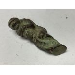 A small bronze monkey amulet.