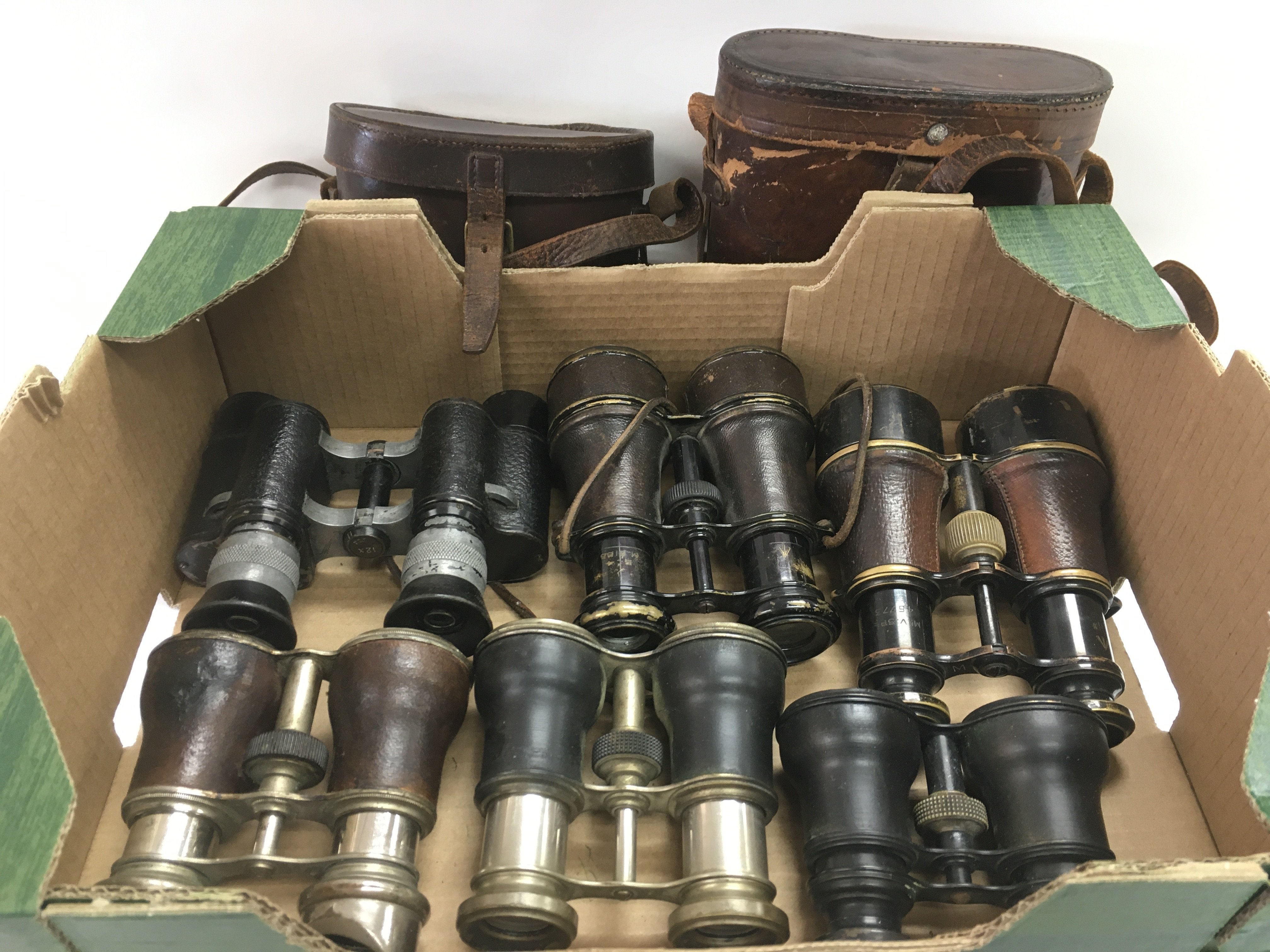 Two pairs of military binoculars and four others (