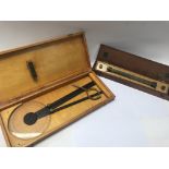 Wooden cased mathematical instruments. One by J Co