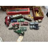 A box of vintage tin plate and die cast toys