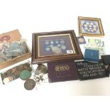 A collection of coins and banknotes including a Ca