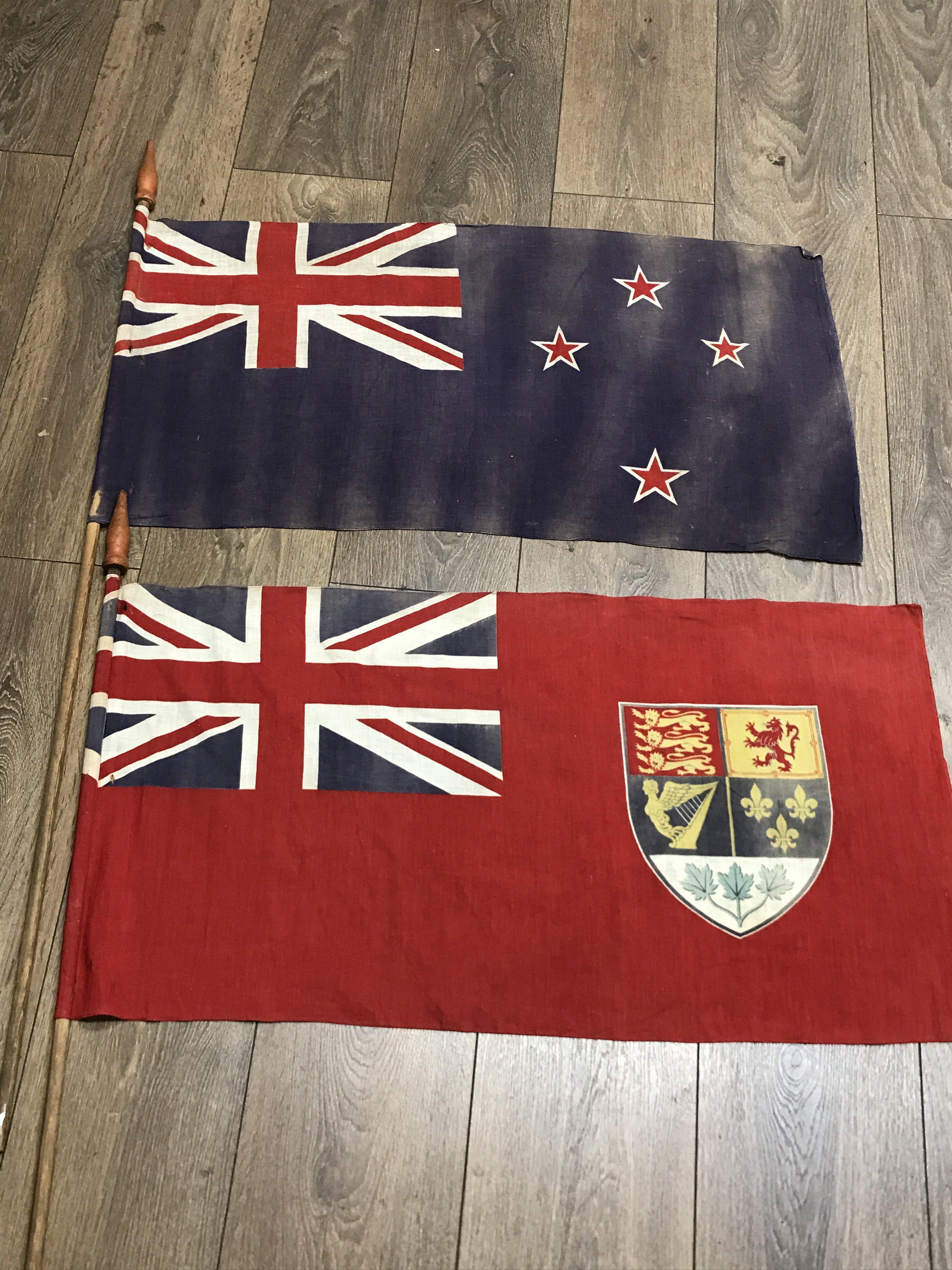 Two naval tiller flags - one is the New Zealand fl