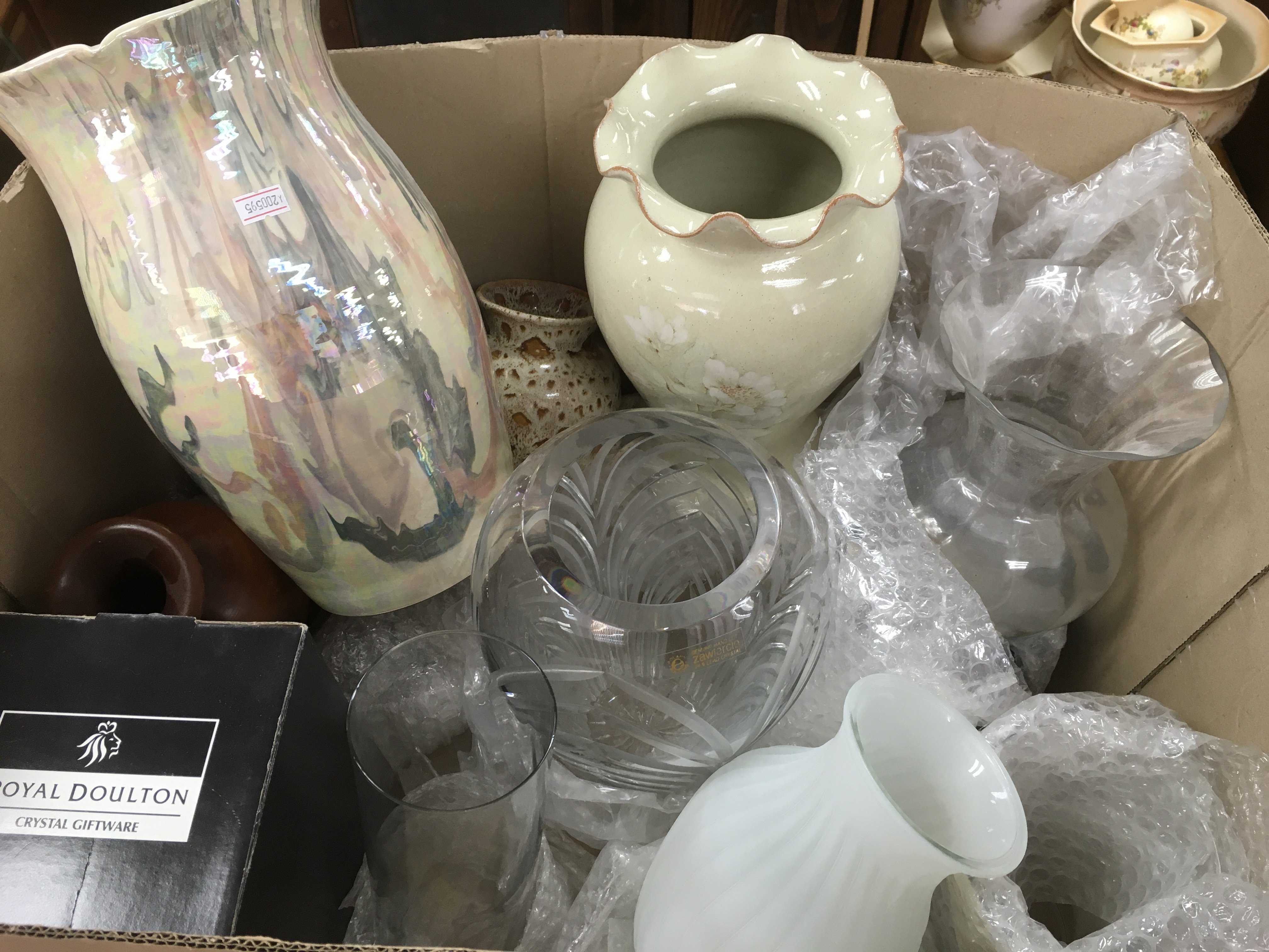 A box containing a collection of glass, ceramics a