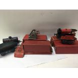 A collection of O gauge Hornby clock work trains a