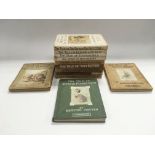 A collection of Beatrix Potter books.