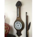 An oak wall barometer.