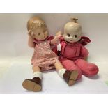 A 1930s composition 3 faced doll. Together with a