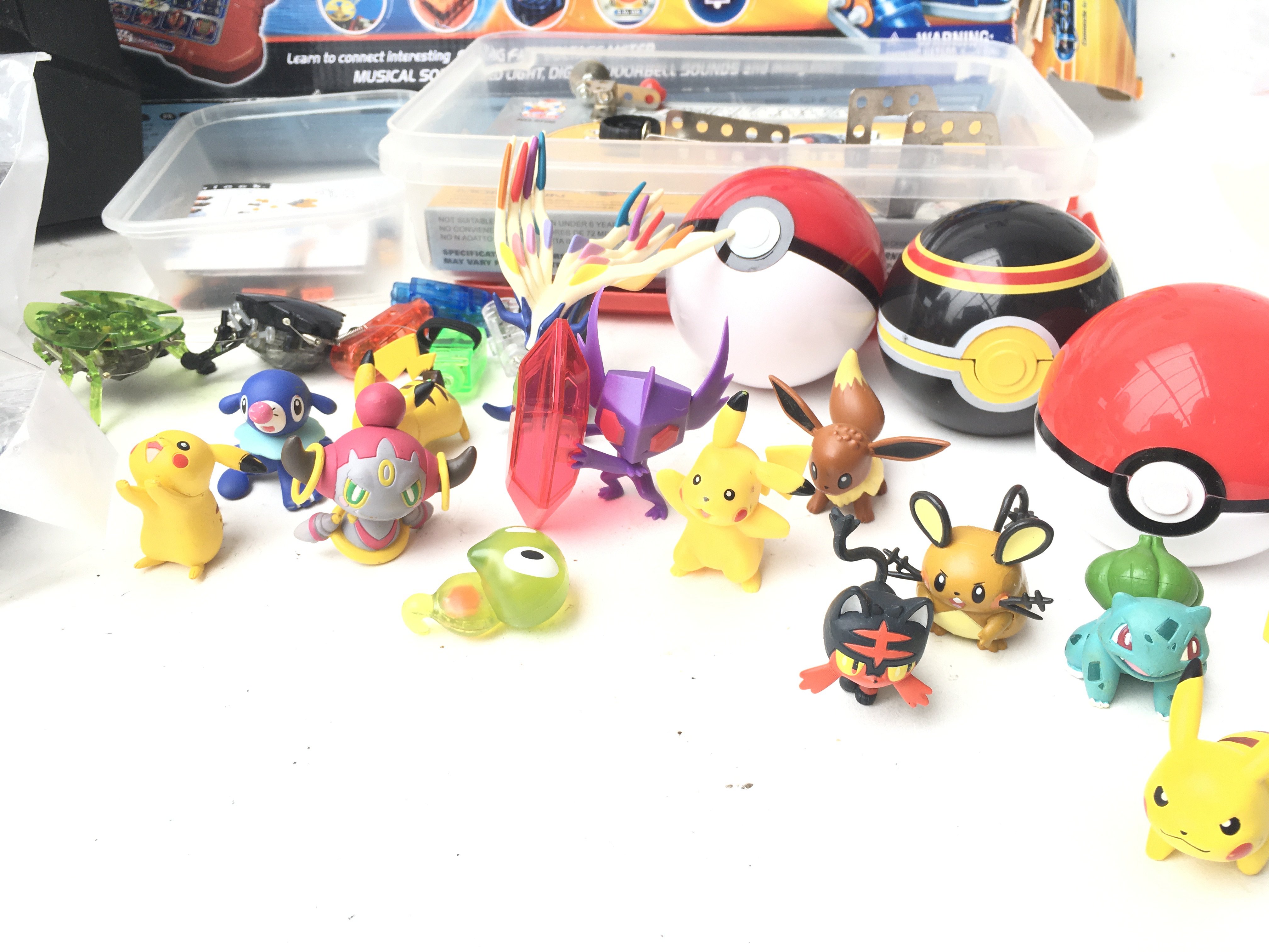 A Collection of Pokemon Figures. A Spy Gear set. A Science Station. 2 X Hex Bugs. Etc.