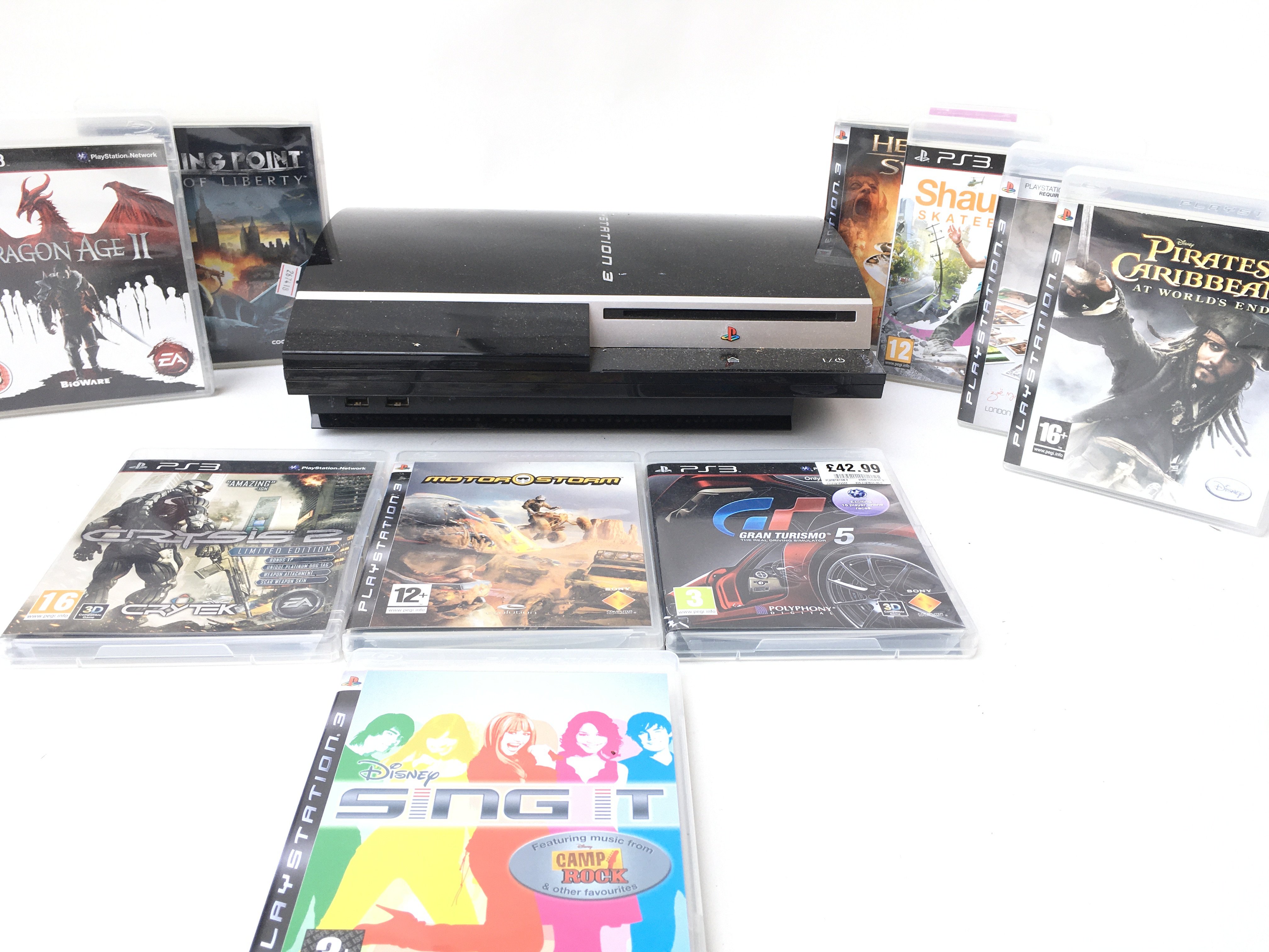 A Sony PlayStation 3 with a Collection of Games.