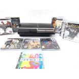 A Sony PlayStation 3 with a Collection of Games.