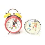 2 Vintage Alarm Clocks. A Micky Mouse Clock and a Football Clock.