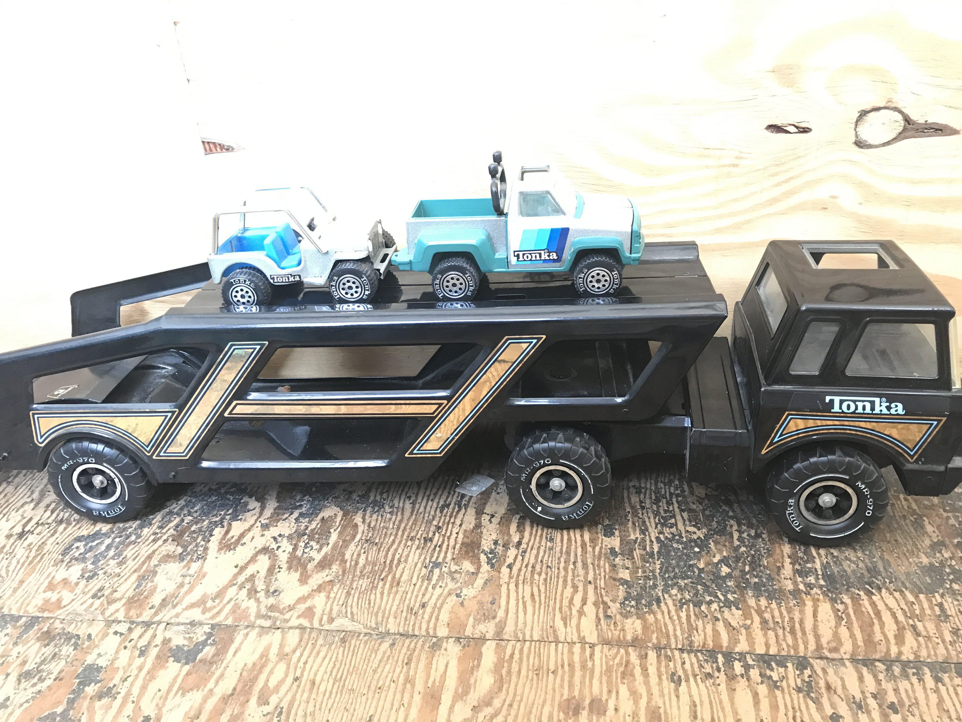 A Vintage Tonka Car Transporter with Vehicles.