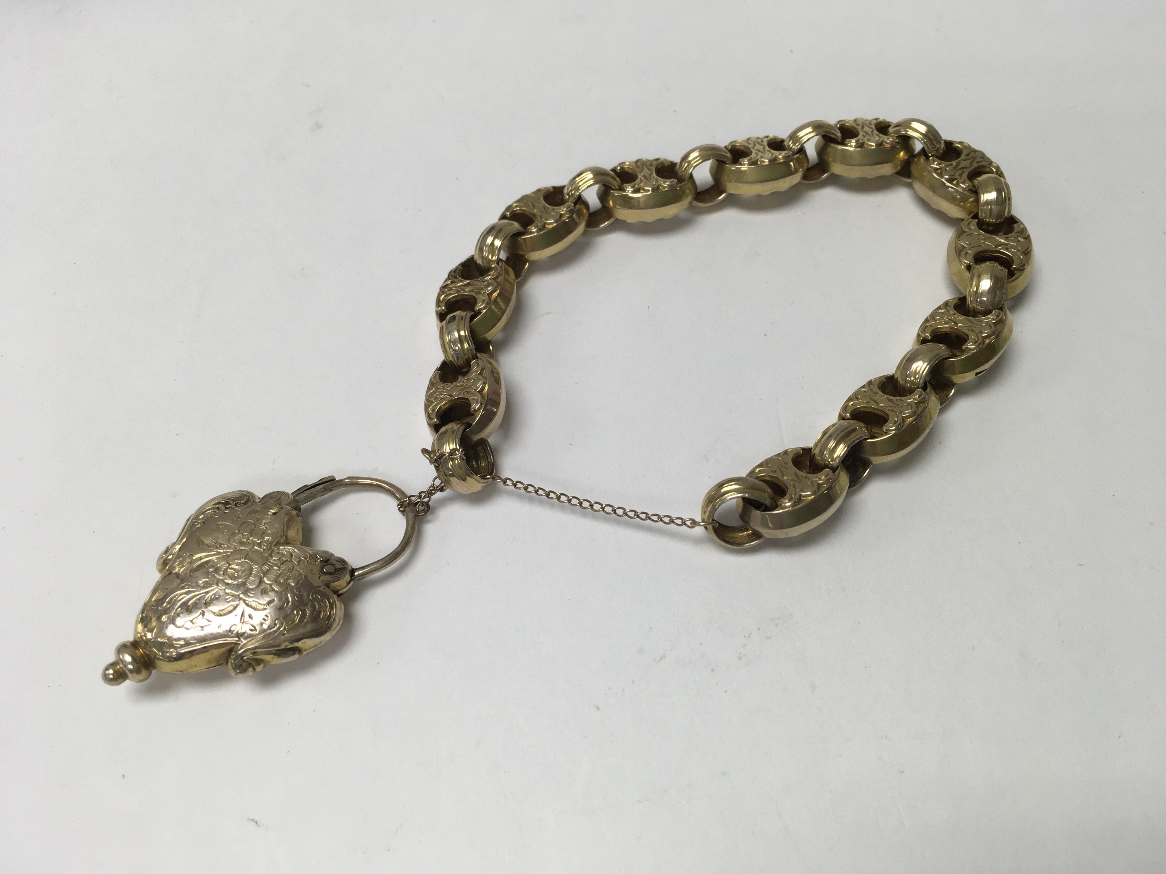 A Victorian link bracelet with heart shape mournin