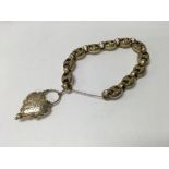 A Victorian link bracelet with heart shape mournin