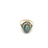 A Victorian gold ring set with turquoise and mothe