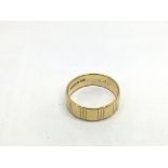 A 22ct gold wedding band, approx 7.7g.