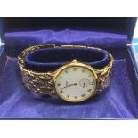 A boxed gents gold plated Tissot watch with relate
