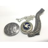 A Large Silver oval pendent set with blue enamel a