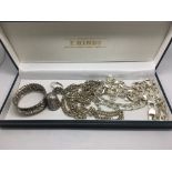 A collection of silver jewellery comprising chains