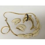 A Trifari jewellery set comprising earrings, brooc