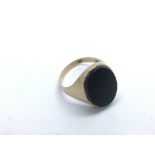A 9ct gold onyx ring, approx 5g and approx size X.