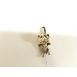 A heavy 9ct gold bulldog pendant with stone set co