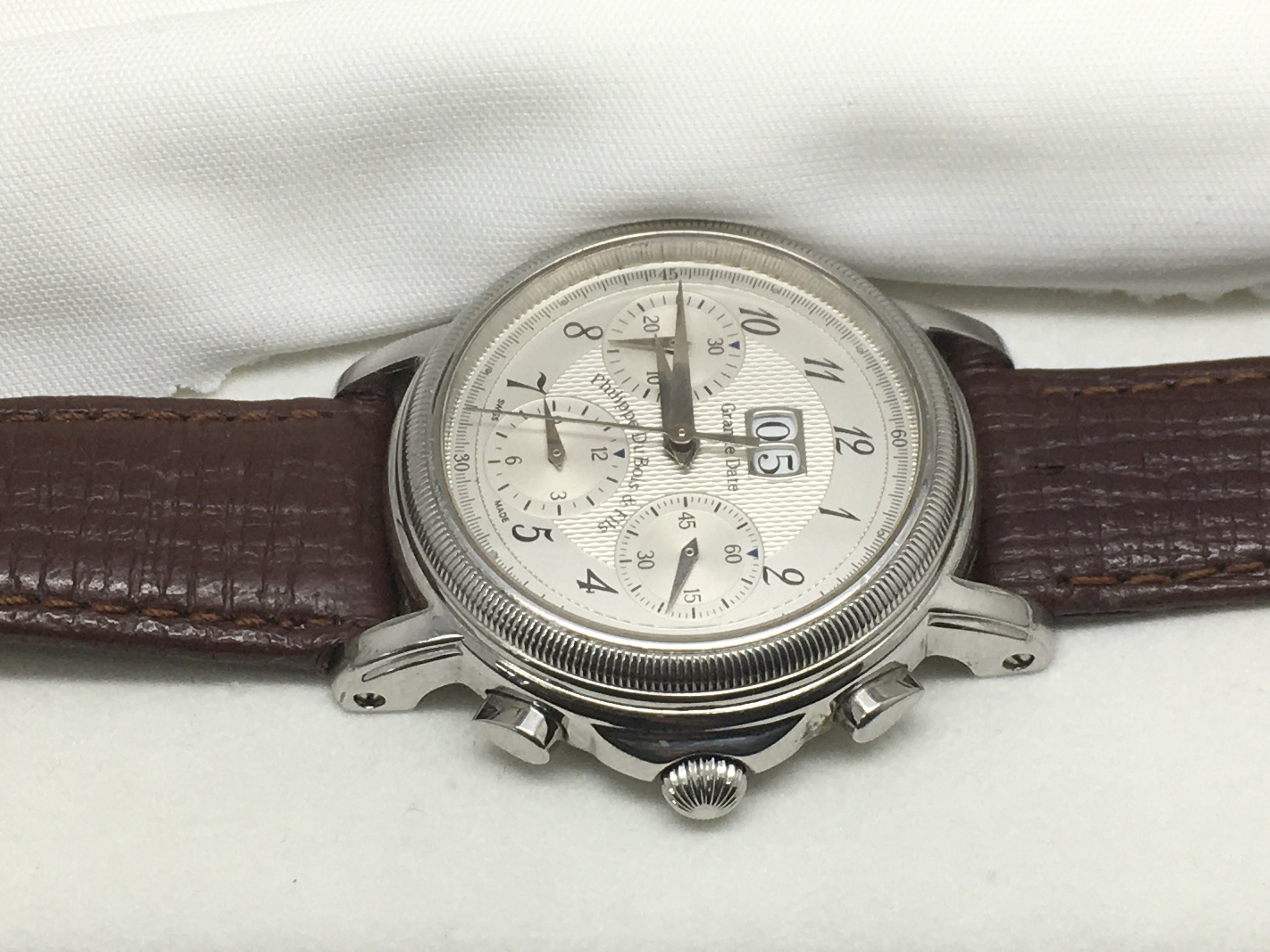 A cased Phillipe Dubois Grande Date watch.