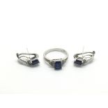 An 18ct white gold ring set with a central blue st