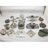 A bag of silver jewellery comprising pendants, bro
