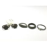 A collection of Roman bronze rings including one with an elevated and engraved bezel, a late roman