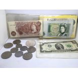 A small collection of coins and banknotes.