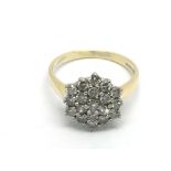 An 18ct white gold diamond cluster ring, approx 4.5g and approx size P.