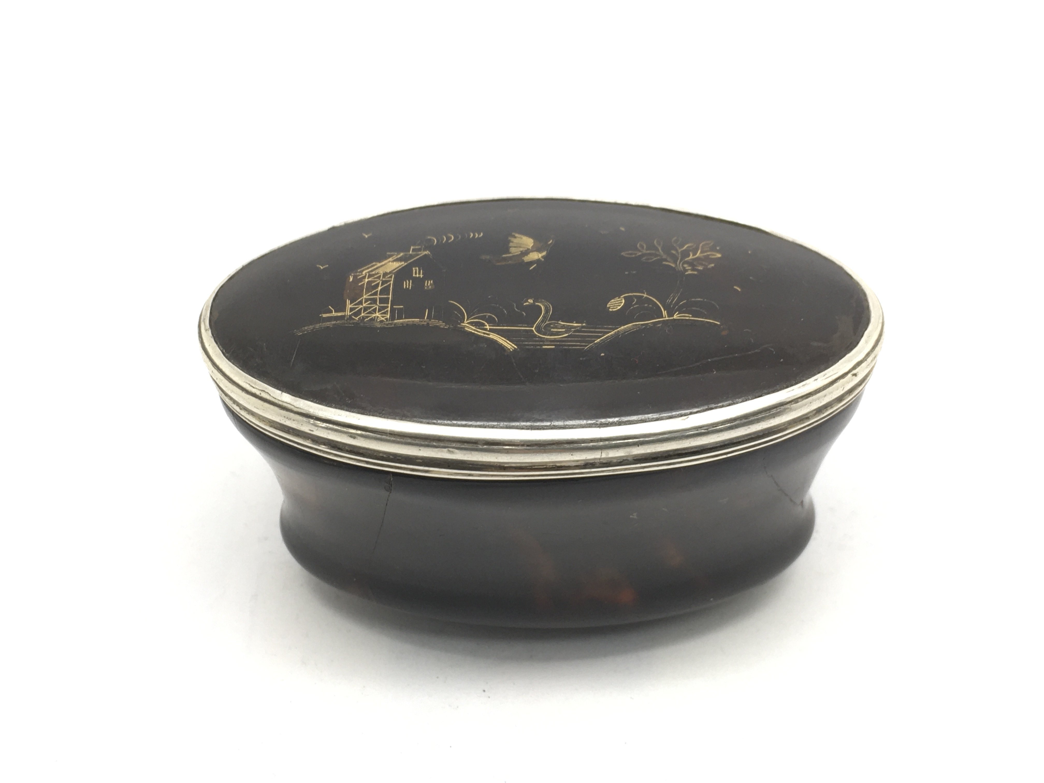 A Georgian tortoiseshell and silver snuff box.